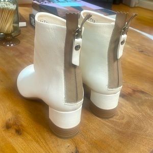 Italian made white leather boots, worn once. Zippers at the back, small heel